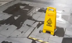 caution slippery wet floor sign on wet floor